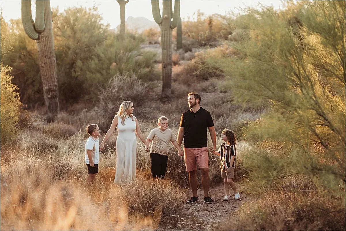 Young family of five walking through the Arizona desert