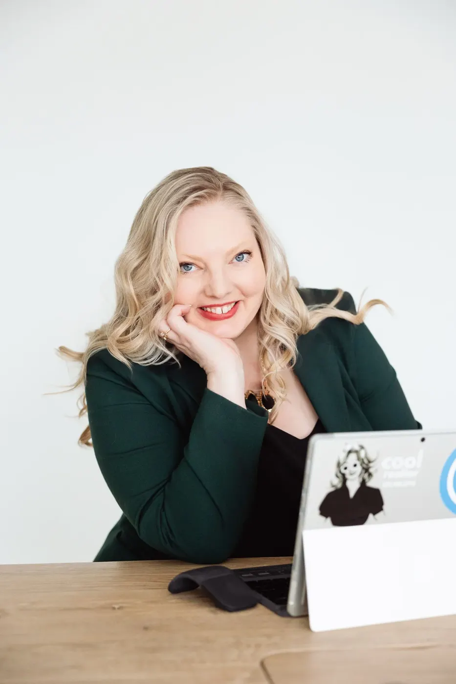 Realtor branding photo at a desk with a tablet