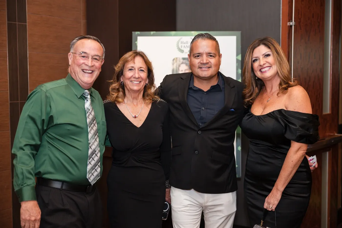 Guests posing together at an awards gala