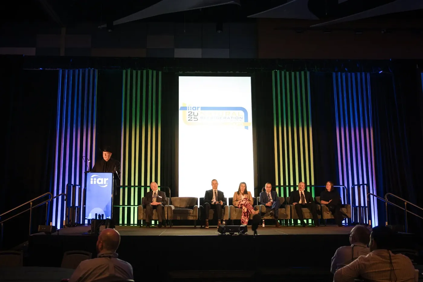 Panel discussion on stage at a Phoenix conference