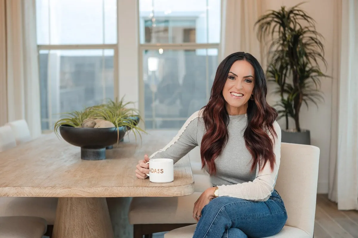 Branding photo of a real estate professional at a table with a coffee mug